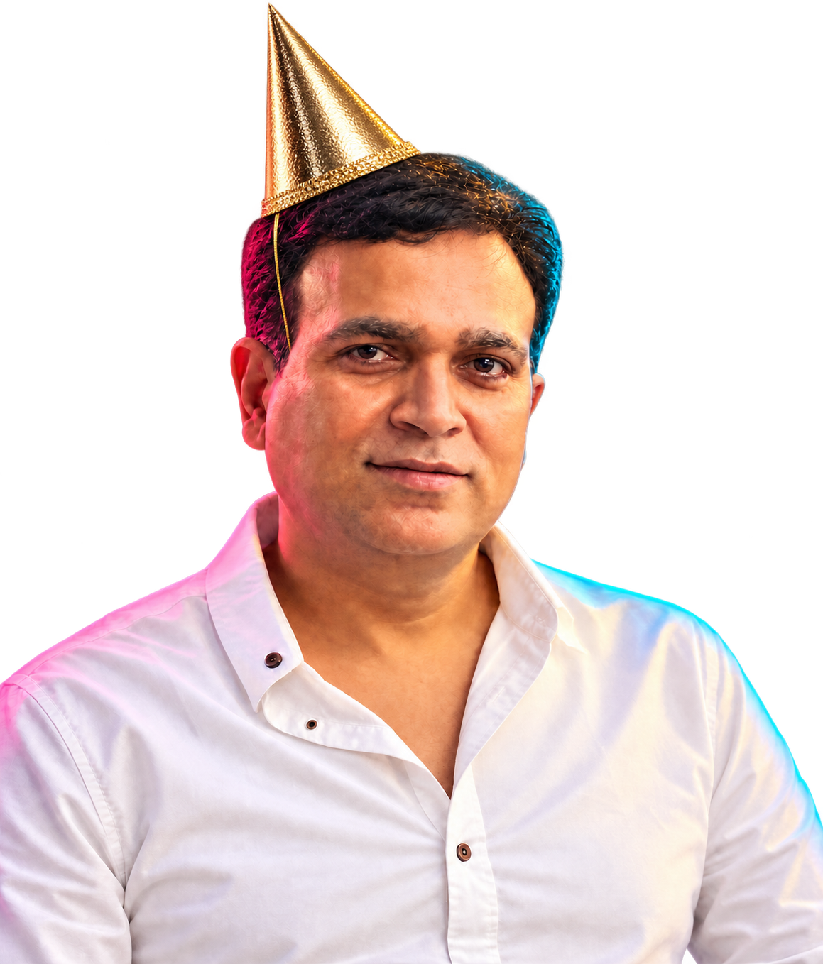 Nirbhay Singh wearing a champagne-gold birthday hat in refined jewel-tone evening light